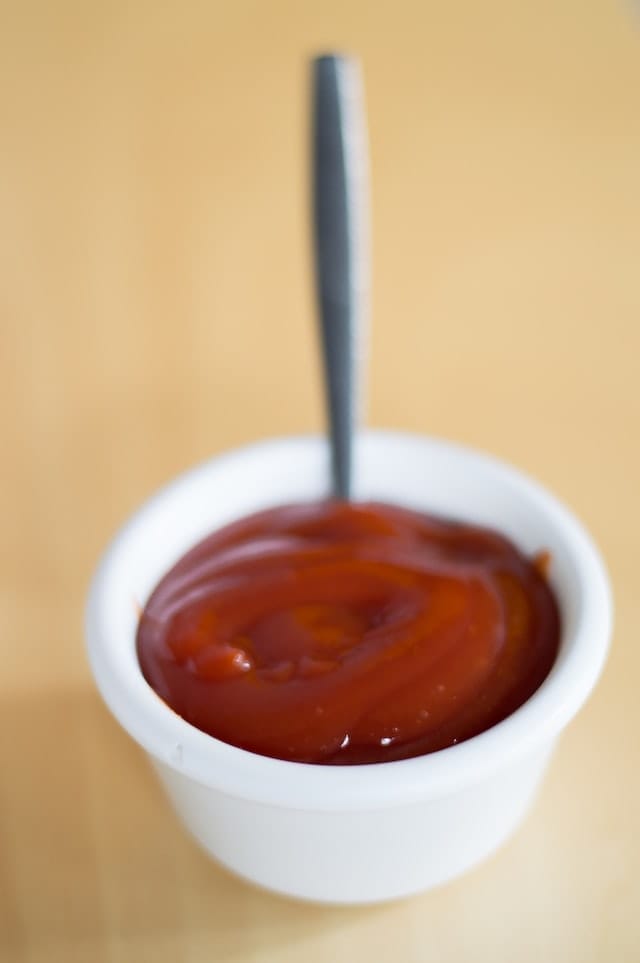 Bowl with ketchup to symbolize cleaning copper.