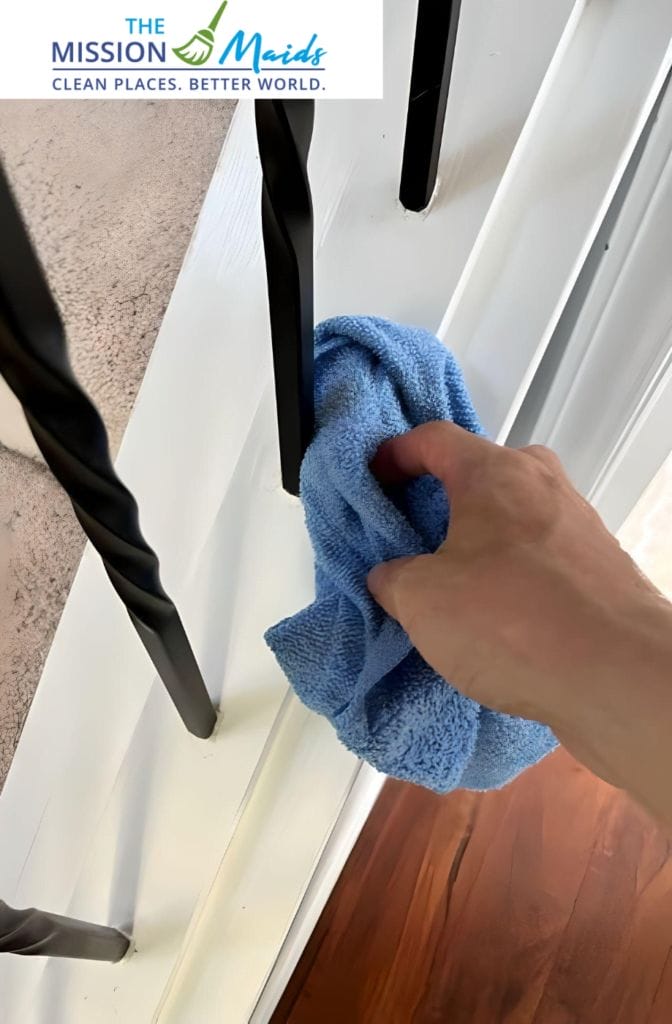 Standard House Cleaning. Cleaning balusters of stairs.